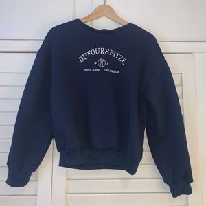 Small navy blue crew neck
